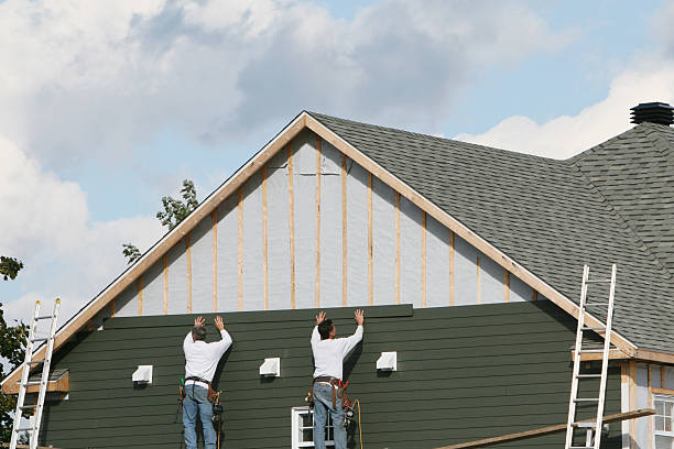 Professional Storm Damage Siding Repair technician working in Topping, VA